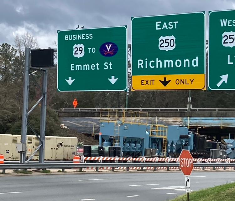 A highway showing a road sign saying Emmet Street